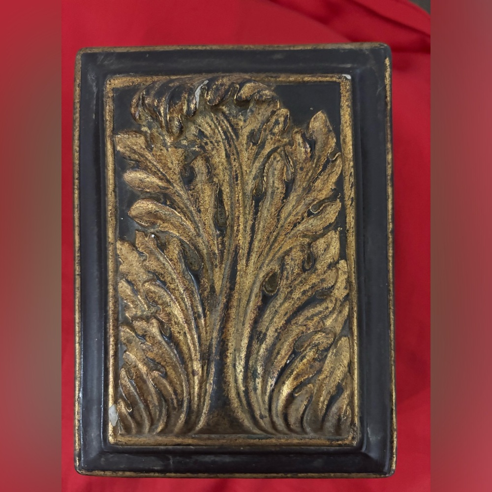 Italian Vintage Ceramic Box.  It is black with gold accents and scrolled top.